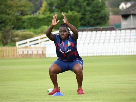 West Indies Women all-rounder Deandra Dottin stretching during a training session. 
