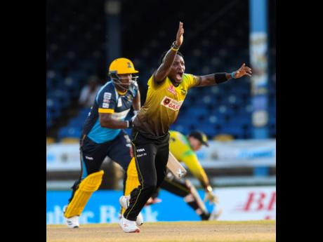 LEFT: Fidel Edwards (right) of Jamaica Tallawahs appeals for leg before wicket against Johnson Charles (left) of Barbados Tridents during the Hero Caribbean Premier League match 14 between Barbados Tridents and Jamaica Tallawahs at Queen’s Park Oval on A
