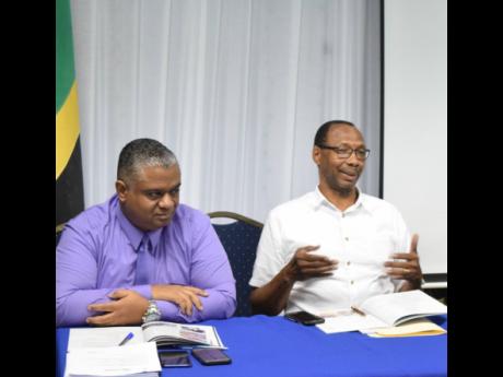 Robert Kinlocke (right) was a member of the managing committee of the Shipping Association of Jamaica (SAJ) and is pictured making valuable contribution to an annual general meeting of the SAJ. Also pictured are Andre Rochester of Maritime and Transport Se