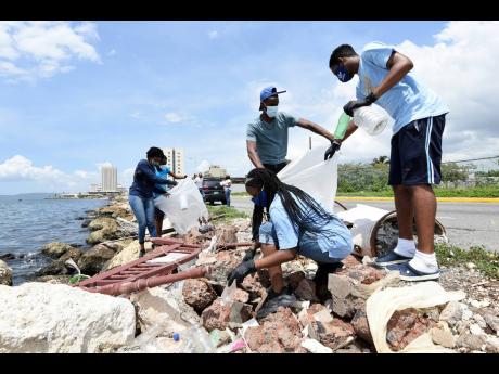 Volunteers at Kingston Harbour participating in an impromptu clean-up last Saturday.