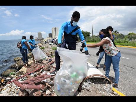 Volunteers turned up to assist Terri-Karelle Reid in her initiative to clear the Kingston Harbour shoreline of plastic bottles, in the vicinity of downtown Kingston, on Saturday morning.