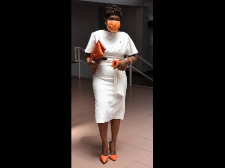 There can be no question as to which party she represents, Denise Daley, MP for St Catherine Eastern, is dressed to the nines in a fitted white dress, played up with infusions of orange.