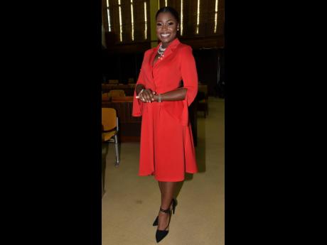 One of the youngest appointed senators, communication specialist Gabriella Morris makes a statement in a bold red wrap-and-tie dress.