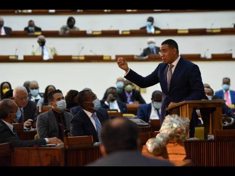 Prime Minister Andrew Holness addresses parliamentarians shortly after they were sworn in at the Jamaica Conference Centre on Tuesday.