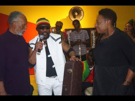 From left, Herbie Miller, Director of the Jamaica Music Museum, Toots Hibbert, and  Olivia Grange, Minister of Culture, Gender, Entertainment and Sport at the opening of the ‘Jamaica Jamaica’ exhibition at the National Gallery in February. 