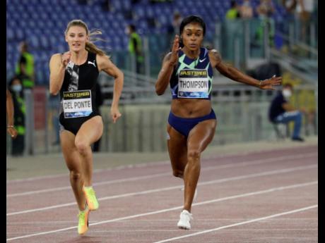 Jamaica’s Elaine Thompson Herah (right) wins the women’s 100m sprint in a world-leading 10.85 seconds at the Golden Gala Pietro Mennea World Athletics Diamond League meet in Rome, Italy, yesterday. At left is fourth-placed Ajla Del Ponte of Switzerland