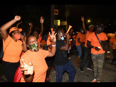 Jubilant People's National Party supporters in St Catherine North Western.
