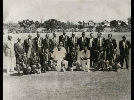 In this 1963 file photo 22 former West Indies cricketers pose for a photograph for Machado Cricket Festival at Sabina Park. On the last day of the second match, they formed a triumphal arch with bats in honour of the present West Indies cricket team who we