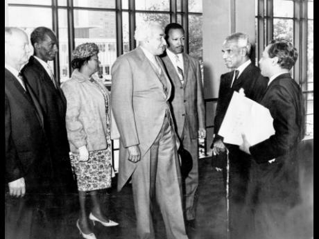 
Sir Alexander Bustamante (centre) is greeted by Krishna Menon (second right), head of the Indian delegation to the United Nations (UN), and his aide on the occasion of the hoisting of Jamaica’s flag at the UN. Others from left are John P. Gyles, ministe