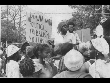 
Dr D.K. Duncan (in glasses), general secretary of the People’s National Party, speaking with a group of demonstrators at the gates of Jamaica House in this mid-1970s photo. The group from South West St Andrew visited Jamaica House, demanding to see Prim