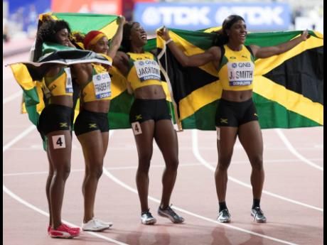 
The Jamaican women’s 4x100m relay team (from left) Natalliah Whyte, Shelly-Ann Fraser-Pryce, Shericka Jackson and Jonielle Smith, celebrate gold in final at the 2019 World Athletics Championships held at the Khalifa International Stadium in Doha, Qatar,