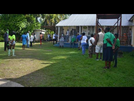 Voters wait at Riversdale polling division to exercise their franchise on September 3.