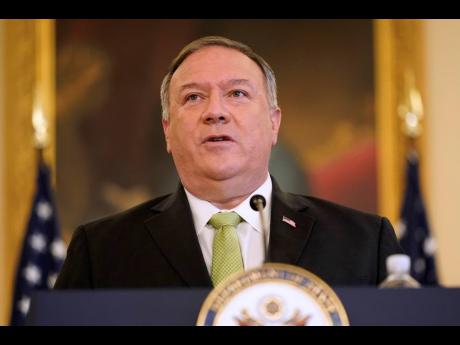 Secretary of State Mike Pompeo speaks during a news conference to announce the Trump administration’s restoration of sanctions on Iran yesterday.  