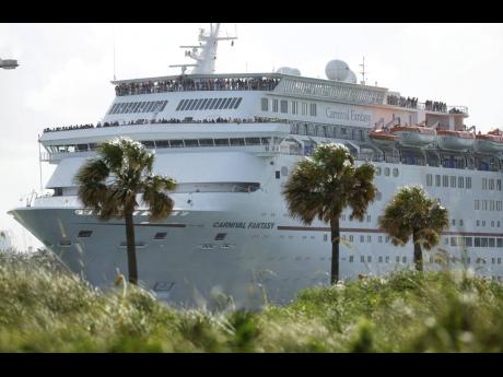 In this Monday, June 20, 2016, the Carnival Fantasy cruise ship leaves PortMiami in Florida. 