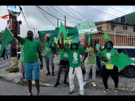 Jamaica Labour Party supporters at Bryce Hill Square, August Town on election day. 