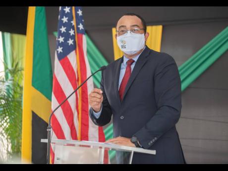 Minister of Health and Wellness Dr Christopher Tufton addresses an audience at the field hospital handover ceremony at National Chest Hospital on Thursday. 
