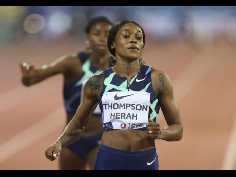 Jamaica's Elaine Thompson Herah moments after victory in the women's 100m sprint in the Wanda Diamond League at the Qatar Sports Club in Doha, Qatar on Friday.