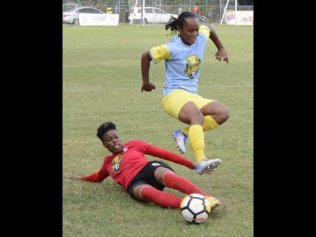 Action between Arnett Gardens Women’s FC 
and Waterhouse Women’s FC during the Jamaica Football Federation Women’s League mid-season final at Winchester Park on Sunday, August 19, 2018.