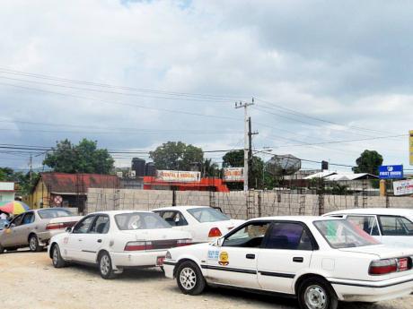 In this file photo taxis are seen lined at the then designated Linstead Transportation Centre. The facility is facing severe revenue crunch due to lack of business and public transport vehicles using the premises. 