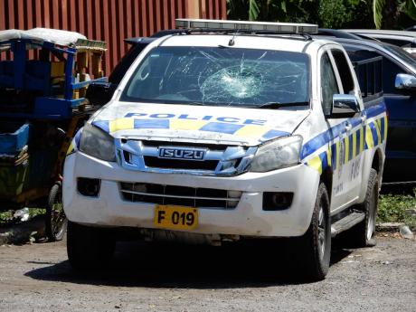 The police vehicle that was damaged by defiant partygoers in Parry Town, St Ann.