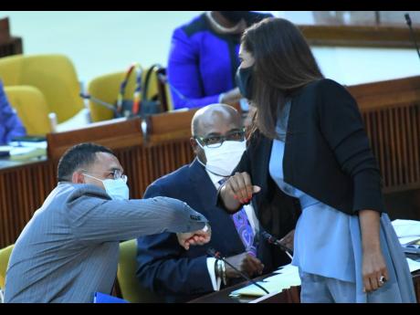 Lisa Hanna, member of parliament for St Ann South Eastern, greets Prime Minister Andrew Holness after being sworn in during a sitting of the House of Representatives at the Jamaica Conference Centre in Kingston on Tuesday.