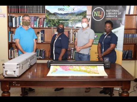 From left: Simon Mitchell, professor of sedimentary geology in the Department of Geography & Geology at The University of the West Indies; Beverley Lashley, national librarian; Robert Stewart, managing director of Geophysx Jamaica; and Janielle Wilson-Rowe