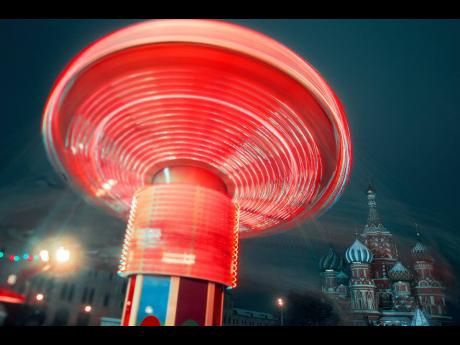 Merry-go-round in Red Square, Moscow, on New Year’s eve, with St Basil’s Cathedral in the background.