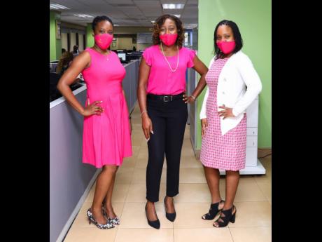 Ladies in pink (from left): Chevaneese Radinal, team lead – Client Services, Sagicor Life; Bregette Rodney, manager – Client Services and Claims, Sagicor Life; and Keisha Hibbert, team lead, claims adjudicator, Claims Unit, Sagicor Life.