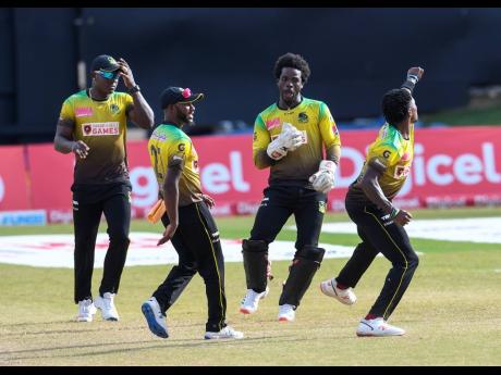 Fidel Edwards (right), Rovman Powell (left), Jermaine Blackwood (second left) and Chadwick Walton of Jamaica Tallawahs celebrate the dismissal of Chris Lynn of St Kitts and Nevis Patriots during the Hero Caribbean Premier League match between St Kitts and 