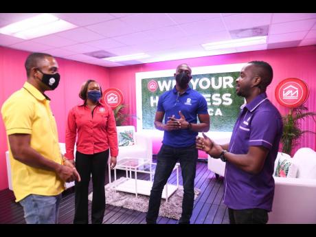 Christopher ‘Johnny’ Daley (right) enjoys a chat with (from left) Jermaine Williamson, senior valuer and realtor, VM Property Services; Shalise Porteous, senior director, National Land Agency; and Dwayne Berbick, corporate and public affairs manager, N
