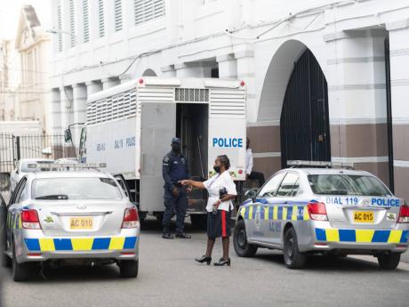 A prisoner transport vehicle waits outside the Supreme Court building in Kingston where the Uchence Wilson Gang trial was under way on Thursday, October 8, 2020.