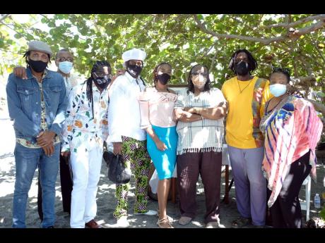  From left, Mackeehan, Mikey Bennett, Ryan Bailey, Sting Ray, Thamar Williams, Dean Fraser, Chevaughn and Sharon Burke gather at Port Royal for the ‘Celebration of Life’ ceremony for Feluke. 