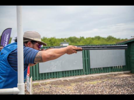 Alex Cunningham lines up a shot during a charity sporting clays event held at the Jamaica Skeet Club on Sunday, May 26, 2019. 