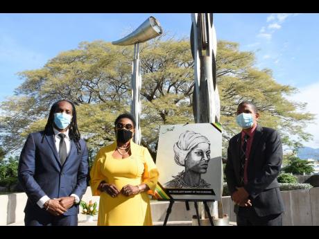 From left:  Ministry of Culture, State Minister Alando Terrelonge, Culture Minister Olivia Grange and Kingston Mayor Delroy WIlliams paying tribute to Nanny of the Maroons.