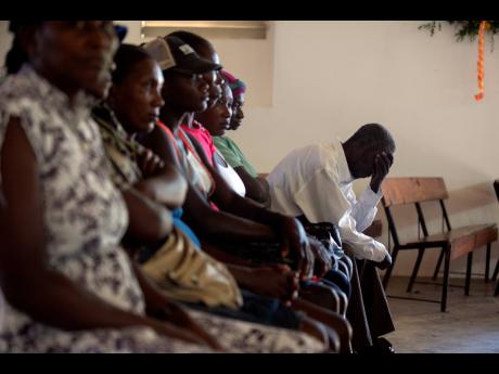 Cholera survivors attend Mass at a Catholic Church to commemorate 10 years since the cholera outbreak in Mirebalais, Haiti, on Monday.