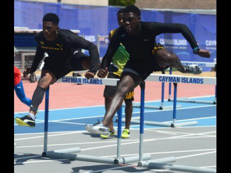 
Jamaican sprint hurdlers Vashaun Vascianna (right) and Neil Sutherland go through their paces during a training session ahead of the start of the Carifta Games at the Truman Bodden Sports Complex in The Cayman Islands last year.