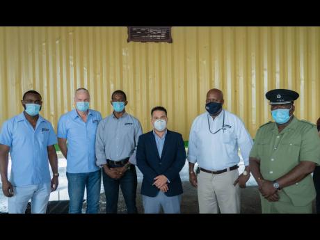 Minister without portfolio in the Ministry of National Security, Matthew Samuda (third right), with (from left) Samuel Jones, technical sales representative; Hans Muller, divisional manager, Dr Patrick Craig, veterinarian; Winston Thomas, regional sales ma