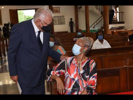 Minister of Labour and Social Security Karl Samuda (left), greets Beverly Anderson Duncan, widow of the late Dr. D.K. Duncan. 

 Minister of Labour and Social Security Karl Samuda (left), greets Beverly Anderson Duncan, widow of the late Dr. D.K. Duncan. 
