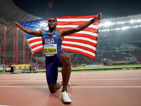 In this September 28, 2019 photo, Christian Coleman of the United States celebrates winning the gold medal in the men’s 100m final at the World Athletics Championships in Doha, Qatar. Coleman was banned for two years for missing three doping control test