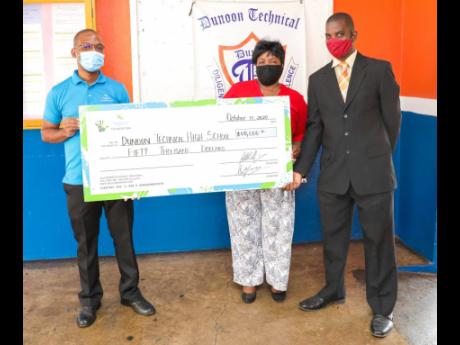 Anthony Howard (left), manager –  Investment Client Services at Sagicor Investments Jamaica, presents a symbolic cheque for $50,000 to Dunoon Park Technical High School principal, Bridgette Desouza-Pancho, and Everett Davids, teacher and coach of the sch