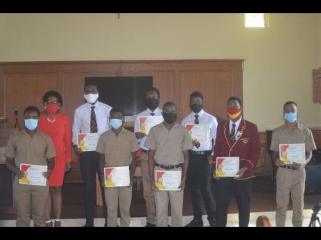 Janet Silvera (back row, left), the only female executive member of the Cornwall College Alumni Association South Florida chapter’s board, and eight out of the nine Cornwall College students who were chosen to receive J$1.2 million in scholarships from t