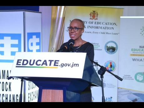 Education Minister Fayval Williams addresses the launch of the public-private-sector initiative ‘One Laptop or Tablet Per Child’ launch at the Jamaica Stock Exchange in downtown Kingston on Thursday.