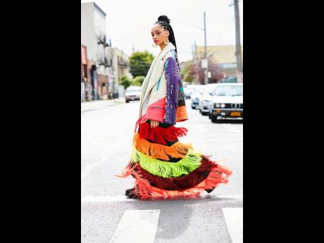 Dressed in multicoloured maxi skirts and graffiti-illustrated oversized jackets and vests, the lean-limbed Davis dons each outfit with a mix of cool urban edge and soft beauty. 