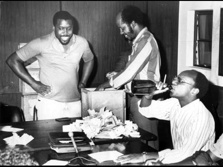 Dr Trevor Munroe, president of the University and Allied Wokers’ Union, celebrating on November 2, 1988, celebrating at the Ministry of Labour’s North Street, Kingston, office his union’s historic victory in the representational rights poll at Hampde