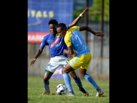 Vere United’s Ray Campbell (left) challenges Stephen Williams of Waterhouse FC during a National Premier League encounter at the Drewsland Stadium on Thursday, September 12, 2019.