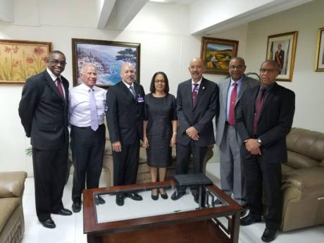 
In this June 2016 photo, the executive of the Jamaica Society for Industrial Security (JSIS) executive posing with Minister of Labour and Social Security Shahine Robinson after paying her a courtesy call, discussing matters such as the ministry’s monito