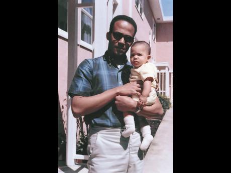 In this April 1965 photo, Donald Harris holds his daughter, Kamala. 