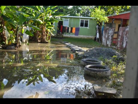 A flooded yard in Bamboo River, St Thomas, which suffered flooding on Sunday.
