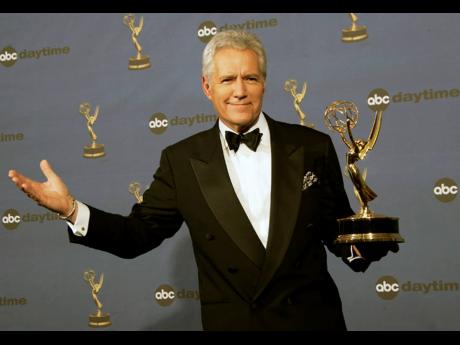 In this Friday, April 28, 2006, photo, Alex Trebek holds the award for outstanding game show host for his work on ‘Jeopardy!’ backstage at the 33rd Annual Daytime Emmy Awards in Los Angeles. Trebek died on Sunday, November 8.