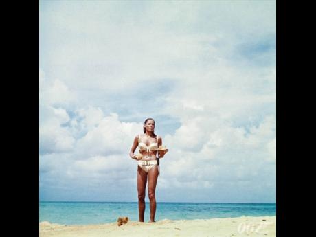 Honey Ryder, played by actress Ursula Andress, in the 1962 James Bond film ‘Dr No’, wears the iconic ivory, two-piece, belted bikini in a scene from the movie. The belt Andress wore belonged to Garth White, a member of the Jamaica College Drum Corps.